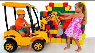 Diana and Roma Playing with Toy Cubes