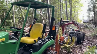 Micro Forestry, logging with a John Deere 2025r and hydraulic timber trailer