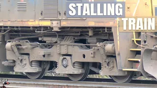 Stalling Freight Train Blows Sand and Wheel Slips Trying to Move