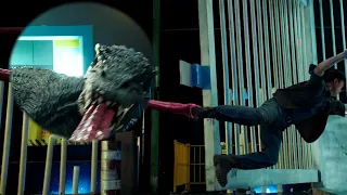 The tyrannosaurus wraps its tongue around the guy's leg and plays tug-of-war with humans!