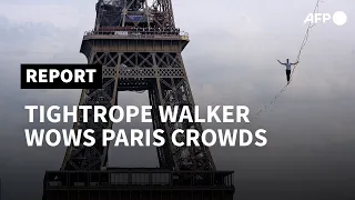 Tightrope walker wows crowds with Eiffel Tower slackline performance | AFP