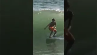 Kid catches crazy wave on a Skimboard