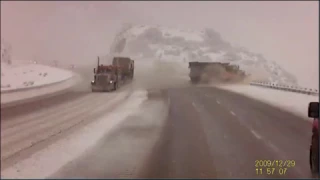 Semi truck sends snow plow over embankment in Utah canyon