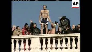 Three divers plunged into Rome's Tiber River on New Year's Day in an Italian tradition that dates ba