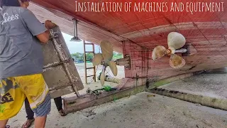 the process of installing two engine units on a large ship