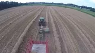 Baling Wheat Straw near Greenford Ohio with a John Deere 2950 tractor pulling a Deere square baler.