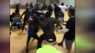 School district investigating video of young girl punched by grown man at youth basketball game
