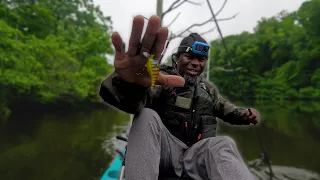 KAYAK FISHING a FLOODED FOREST IN THE RAIN !! (CRANKBAIT GOT SMOKED)