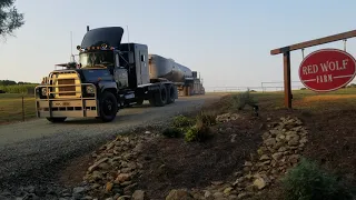 A CONVOY OF MOVIE TRUCKS RIDING OFF INTO THE SUNSET!