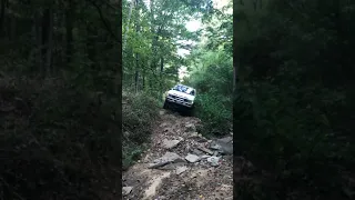 93 pathfinder wheeling through a creek