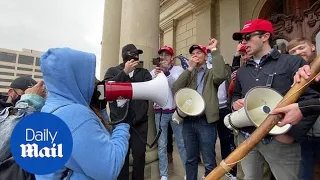 Trump supporters chant 'We Won!' as BLM protester confronts them