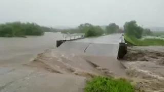 Flood inundates farmland, bridges in NE China city