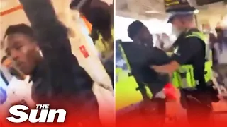 Cops kick 'covidiot' off train in face mask scuffle