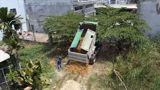 Great job! Teamwork hard to build foundation house in the grass mud process by Dozer & dump trucks