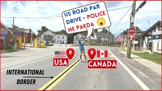 US - CANADA BORDER at the MIDDLE of the ROAD