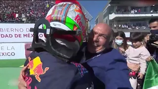 sergio perez giving his dad a huge hug after getting a podium mexico grand prix