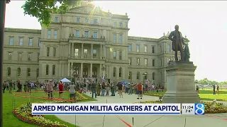 Armed militia supporters rally outside state Capitol