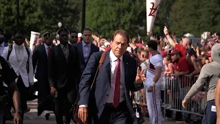 Walk of Champions: The Alabama football team arrives for Utah State