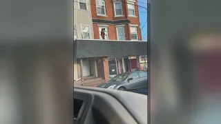 Video shows Samaritan rescuing toddler from roof of Rhode Island building