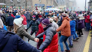 Public Ceilidh to Dashing White Sergeant Scottish Dance during Pitlochry New Year 2024 Street Party