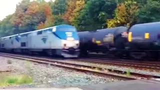 Fast Amtrak Passes Slow  Freight Train