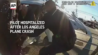 Dramatic bodycam video shows L.A. cops pulling pilot from plane moments before train hits it