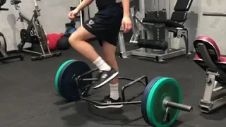 Trap bar deadlift into single leg hurdle hop