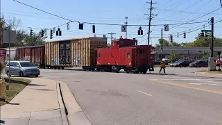 Strangest Railroad Crossing Ever!  Caboose Leads Train Across, Conductor Flags Traffic