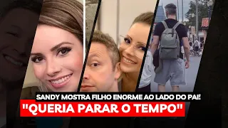 Sandy mostra o filho enorme ao lado do pai