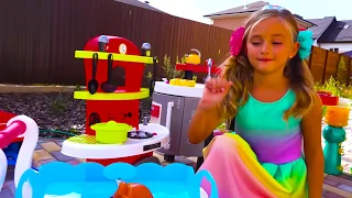 Sasha Playing with cute kitchen and kids cooking playset