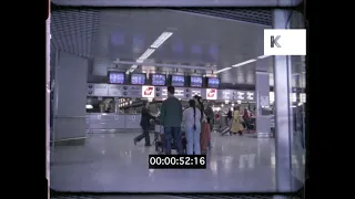 1990s UK, Heathrow Airport Check in desks, 16mm