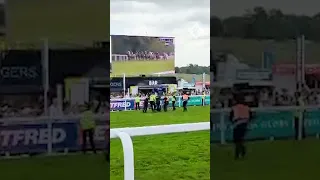 Epsom Derby protester tackled to the ground on track during race