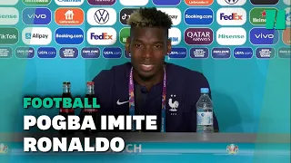 Paul Pogba retire une bouteille de bière du décor d'une conférence de presse