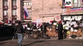 Pro Russia protesters outside city buildings in east; military continue "anti-terrorist operation"