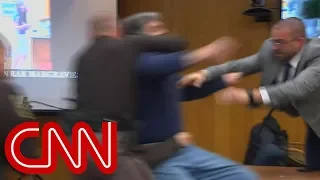 Father lunges at Larry Nassar in court