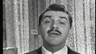 Ernie Kovacs assists black & white television viewers