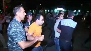 Dozens wounded in further night of clashes at besieged Yerevan police station