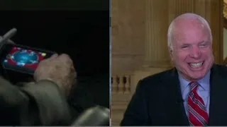 McCain plays poker during Syria hearing