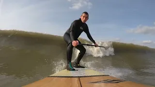 sup en surfing in slowmotion