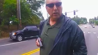 Cop Pulls Gun On Biker (VIDEO)