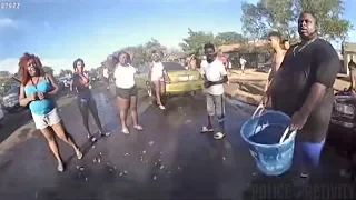 Female Cop Gets Sprayed by People With Water Guns