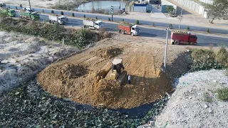 Nice Technique Filling Land Project Operated By Komatsu Bullsozer DR51px and Dump Trucks Team