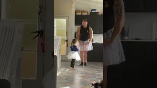 Dad and toddler daughter are doing ballet together!