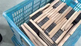 Production of wood handle steel wire brush