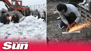 Volunteers build barricades to slow the Russian military advance on Odessa