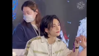 Hyunjin staring and holding hand of fan at fanmeet in China