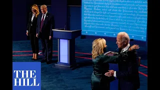 First Lady Melania Trump and Jill Biden go to the stage at the end of the first presidential debate