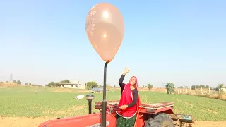 Indian lady Experiment tractor silencer v/s balloon 🎈//क्या ट्रैक्टर गुब्बारे को फाड़ देगा?