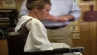 woman shaves her hair at the barber shop