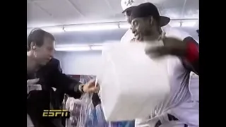 Deion Sanders throws a bucket of water on a reporter (1992)